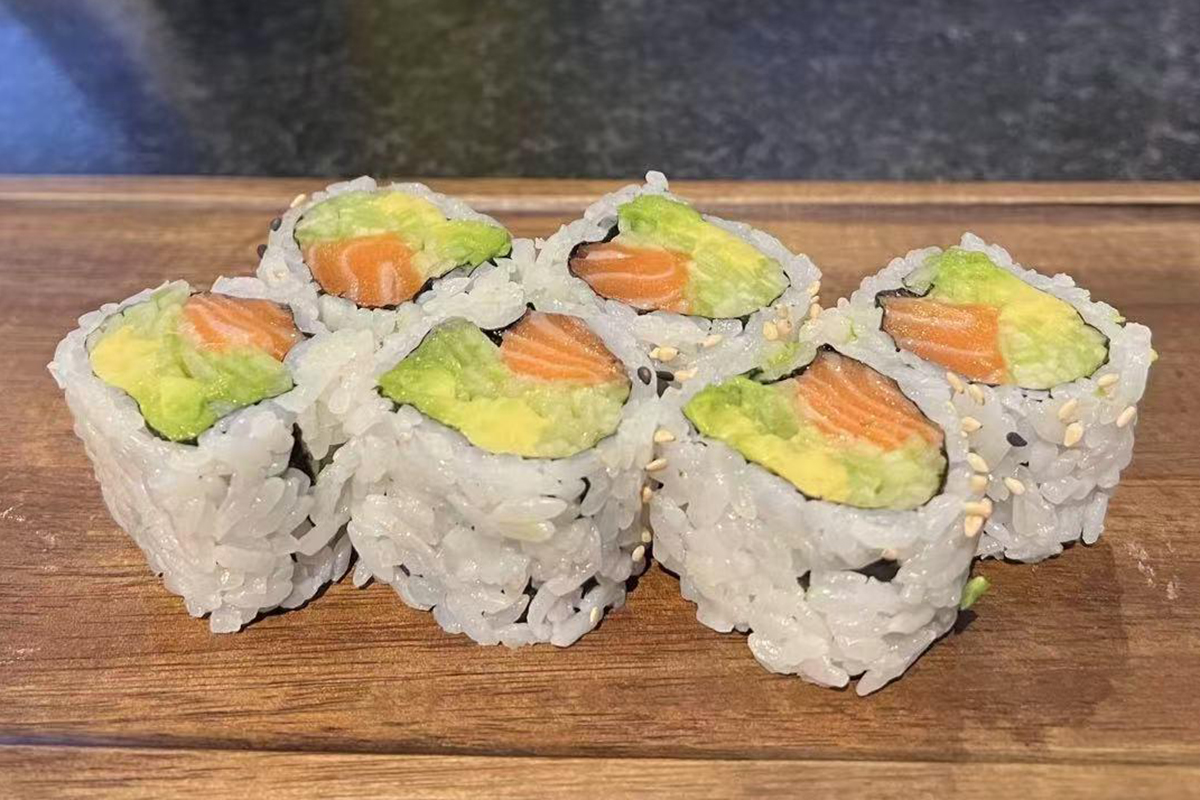 Alaska Roll sushi on a wooden board at Fusion Cuisine，a Asian Fusion Restaurant in Madison