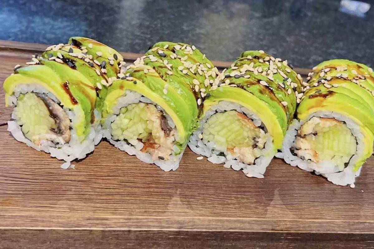 Dragon Roll sushi on a wooden board at Fusion Cuisine，a Asian Fusion Restaurant in Madison