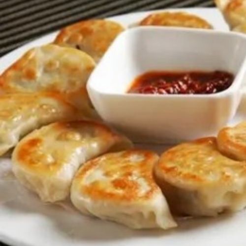 Pan-fried dumplings with chili dipping sauce at Fusion Express chinatown, Chinese Restaurant in East Hampton