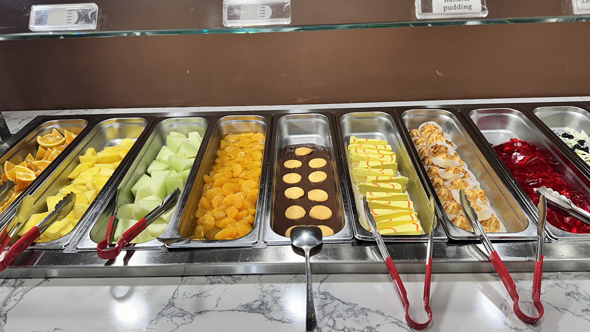 Mongolian & Sushi-Asian-Fusion-Restaurant-Self-service-dessert-and-fruit-Carteret Self - service dessert and fruit counter with oranges, melons, cakes at Mongolian & Sushi,a Asian Fusion Restaurant in Carteret