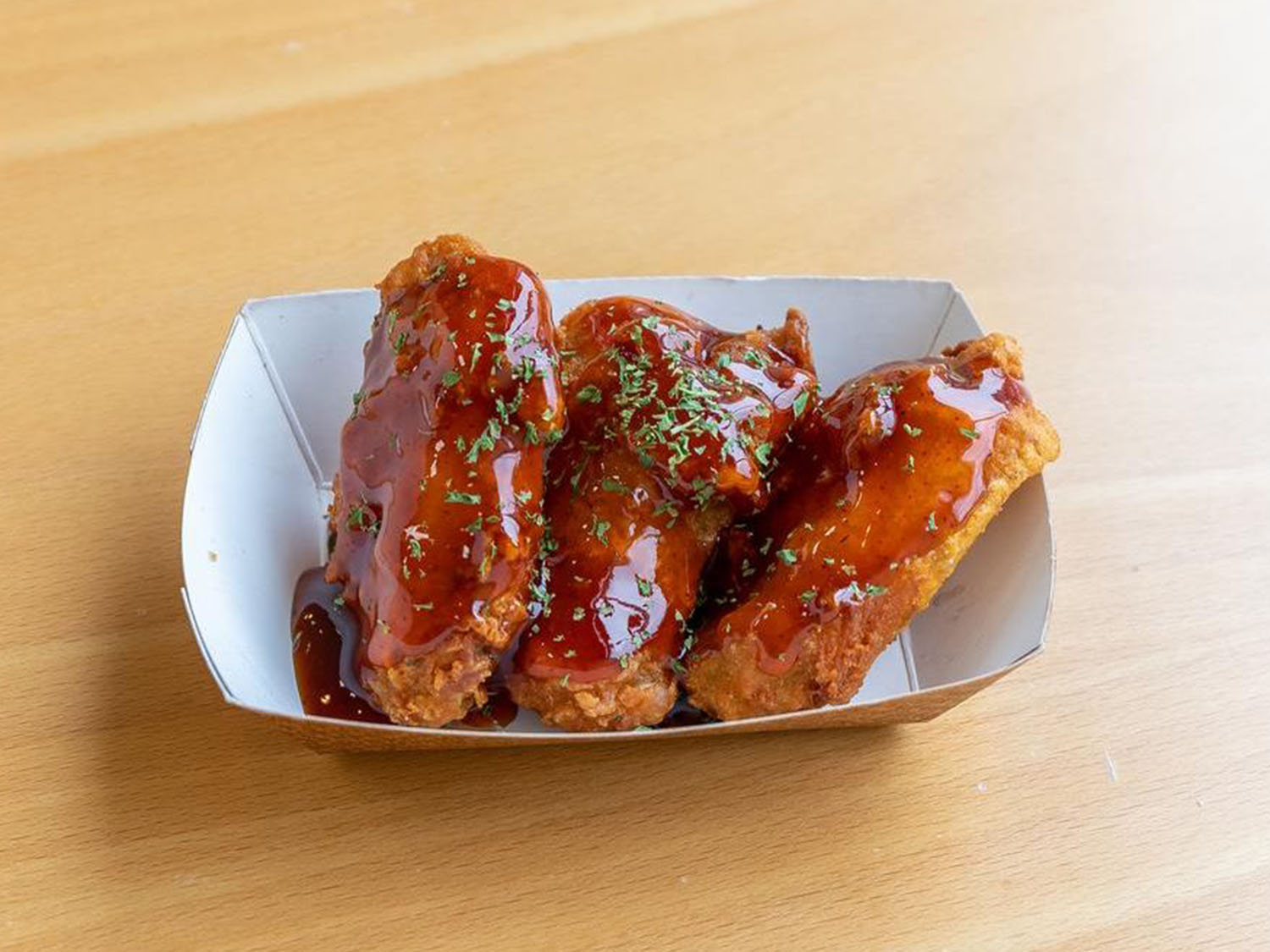 Barbecue chicken wings with herbs at Fusion Poke, an Asian Fusion Restaurant in Milwaukee