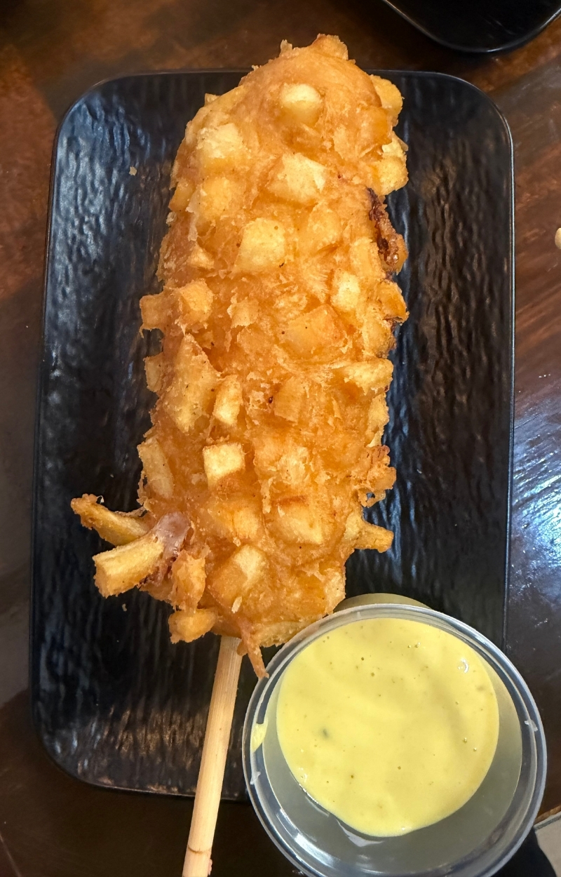 Crispy corn dog with potato flake coating and honey mustard at Gangnam Crispy, a Korean Restaurant in Toledo