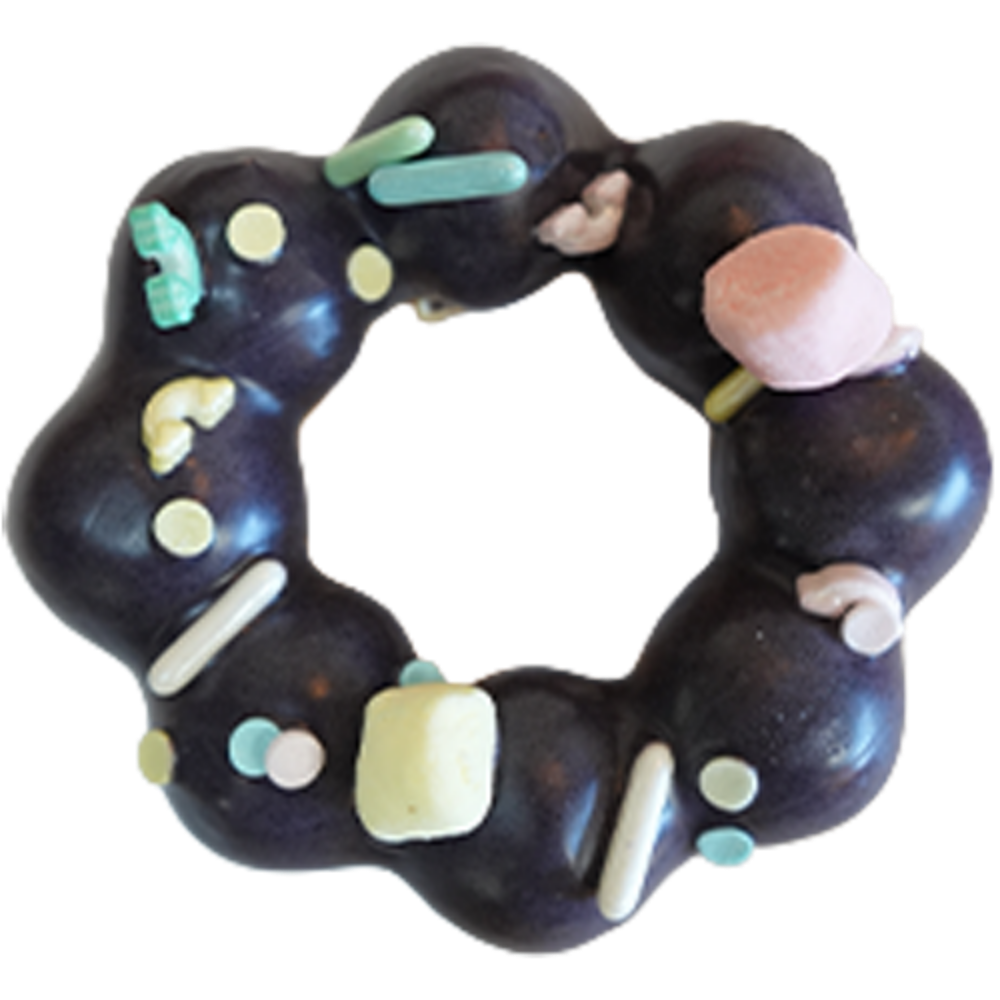 Dark purple mochi donut with pastel marshmallows and sprinkles at Gangnam Crispy, a Korean Restaurant in Toledo