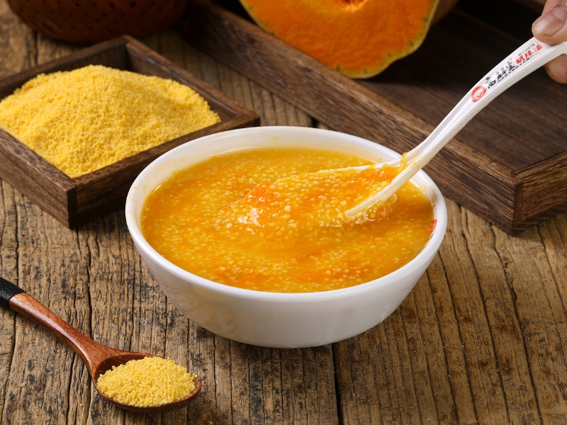 Creamy pumpkin millet porridge with sweet pumpkin chunks at Gao Qunsheng's Spicy Soup, a Chinese Restaurant in Flushing