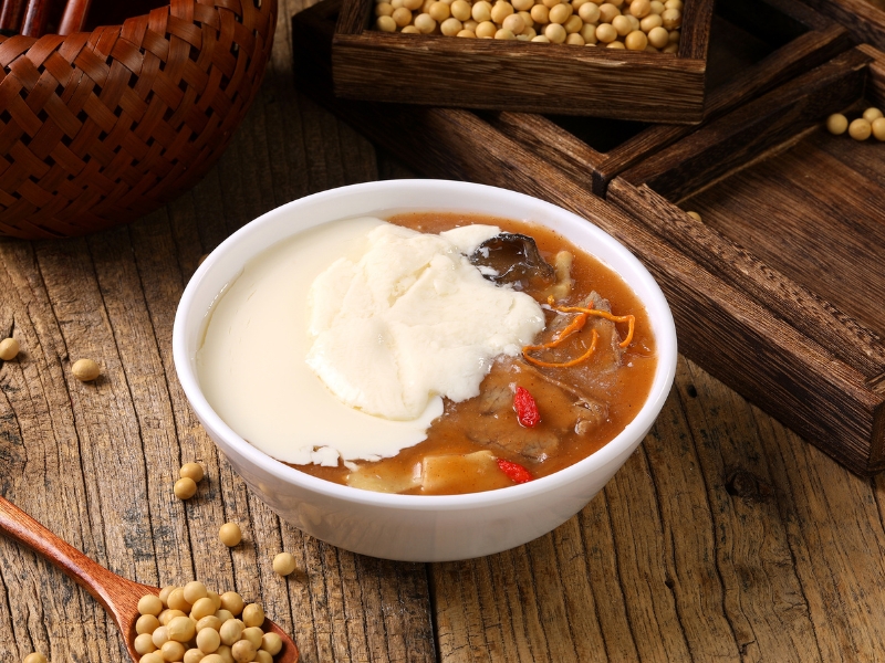 Creamy tofu pudding paired with savory beef herbal soup at Gao Qunsheng's Spicy Soup, a Chinese Restaurant in Flushing