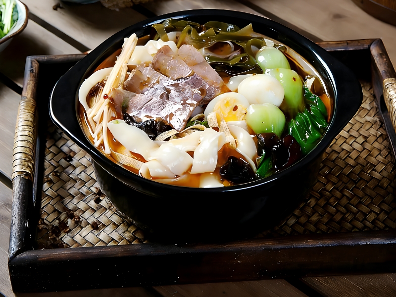 Hearty beef noodle hot pot with assorted ingredients at Gao Qunsheng's Spicy Soup, a Chinese Restaurant in Flushing