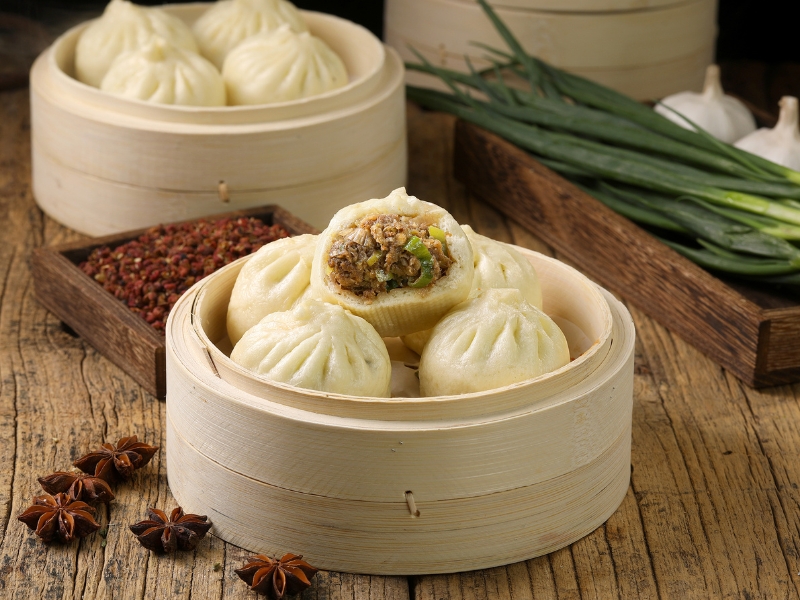 Soft steamed buns stuffed with savory minced meat at Gao Qunsheng's Spicy Soup, a Chinese Restaurant in Flushing