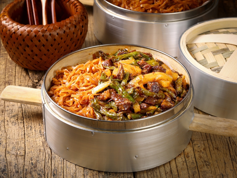 Steamed noodles with green beans and braised pork chunks at Gao Qunsheng's Spicy Soup, a Chinese Restaurant in Flushing