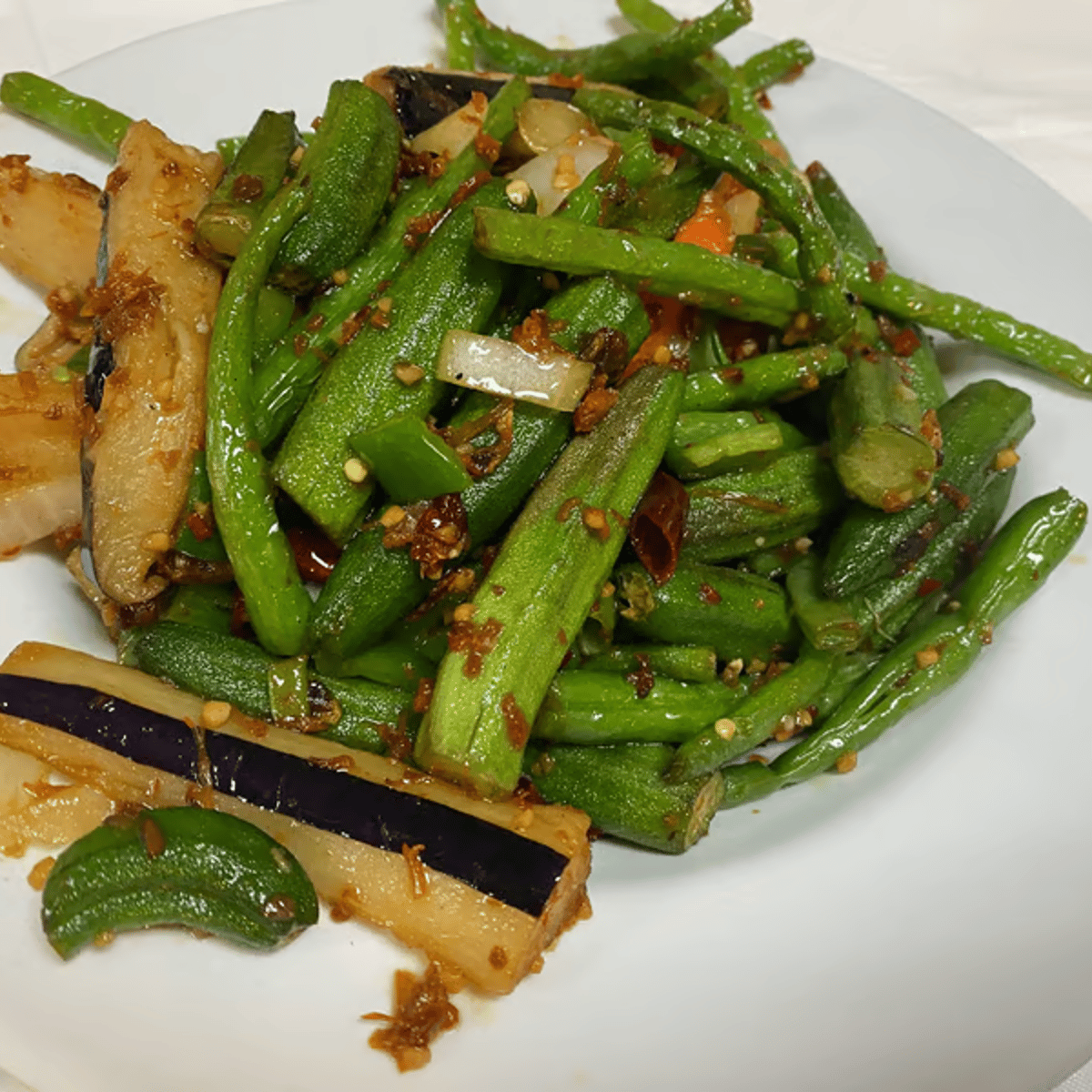 Garden-Restaurant-Chinese-Restaurant-Triple-Delight-Garland Crisp green beans, tender asparagus, and sautéed eggplant with a savory XO sauce at Garden Restaurant,a Chinese Restaurant in Garland