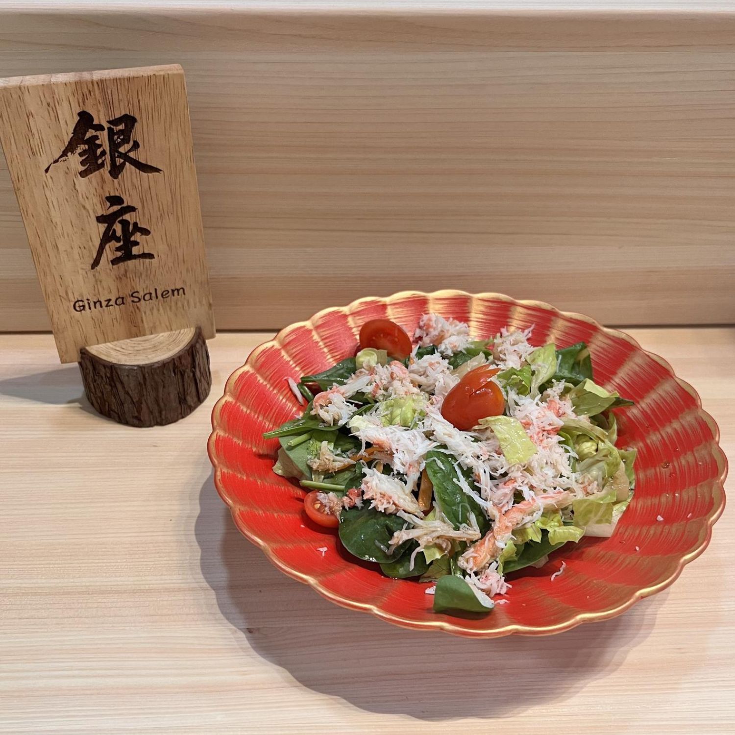Fresh salad topped with crab meat and cherry tomatoes at Ginza Sushi and Ramen, a Japanese Restaurant in Salem