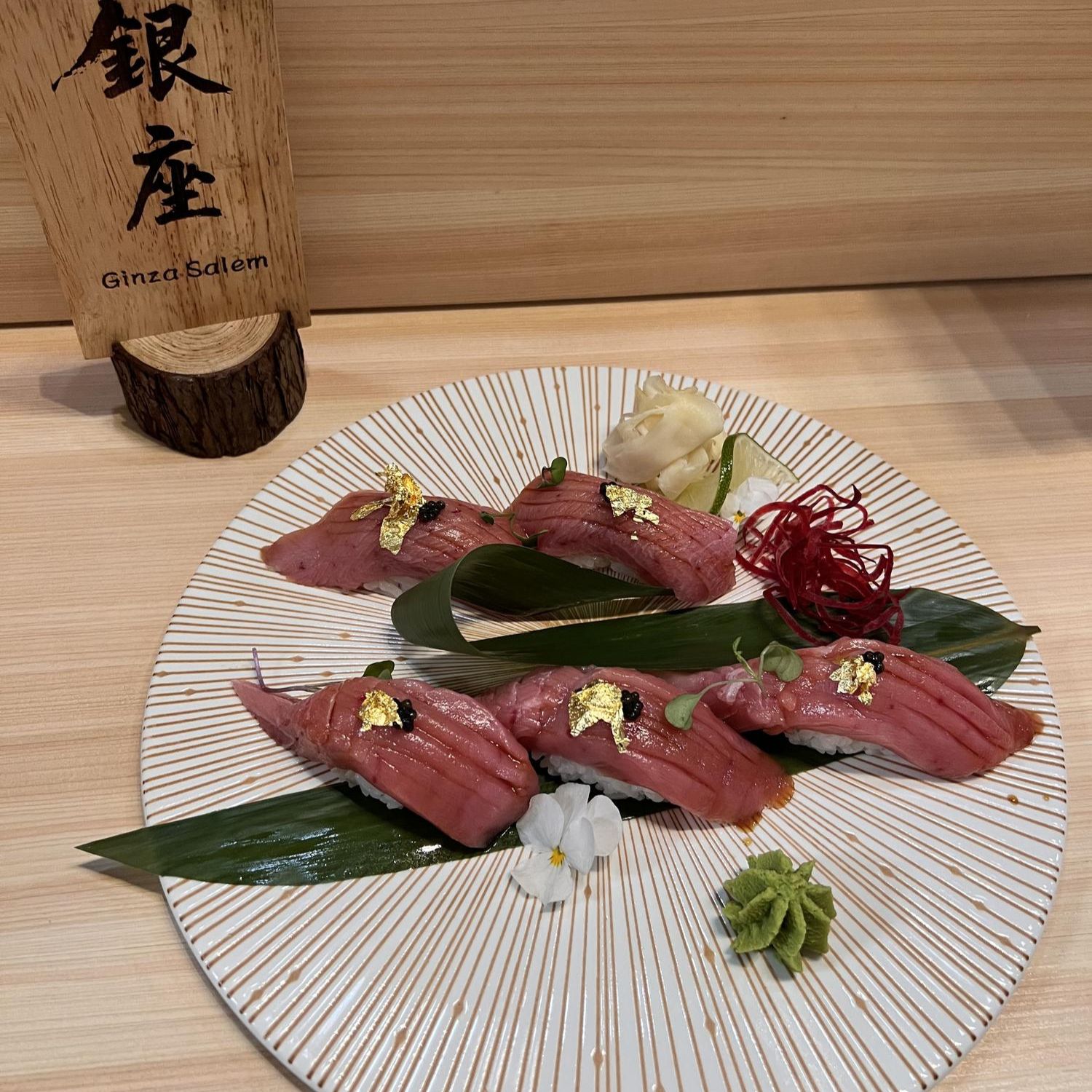 Tuna nigiri platter garnished with gold leaf and wasabi at Ginza Sushi and Ramen, a Japanese Restaurant in Salem