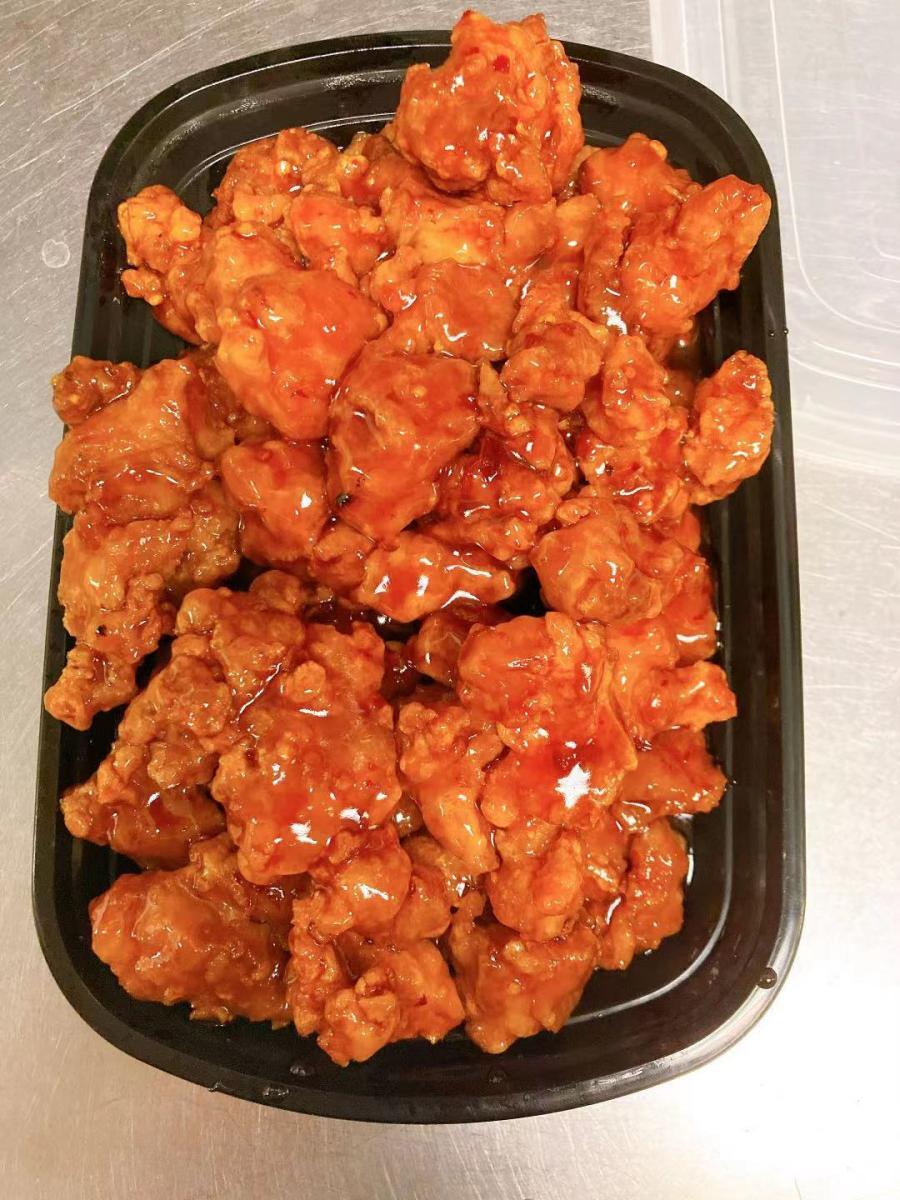 Orange chicken with crispy fried pieces and sweet sauce at Golden China Restaurant in Front Royal