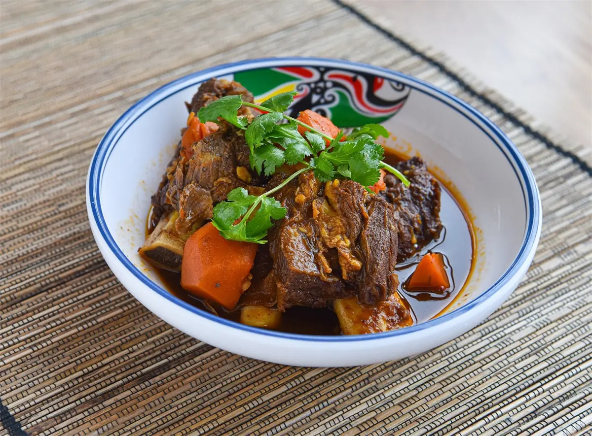 Braised beef ribs with carrot in rich gravy at Golden Dragon，a Chinese Restaurant in New York
