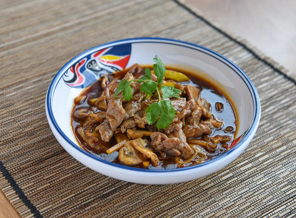 Braised beef slices with mushrooms in savory brown sauce at Golden Dragon，a Chinese Restaurant in New York