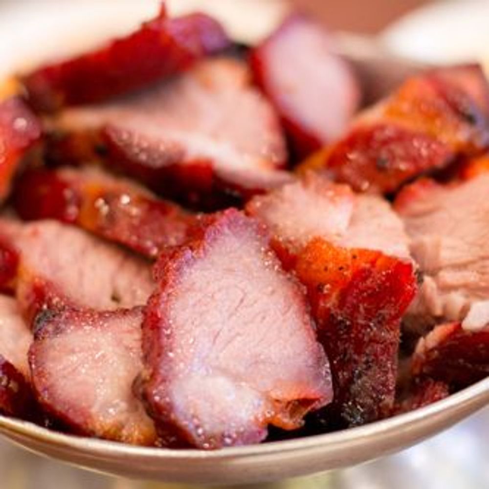 Sliced glossy red roasted char siu pork in a bowl at Golden Dragon Restaurant, a Chinese Restaurant in East Troy