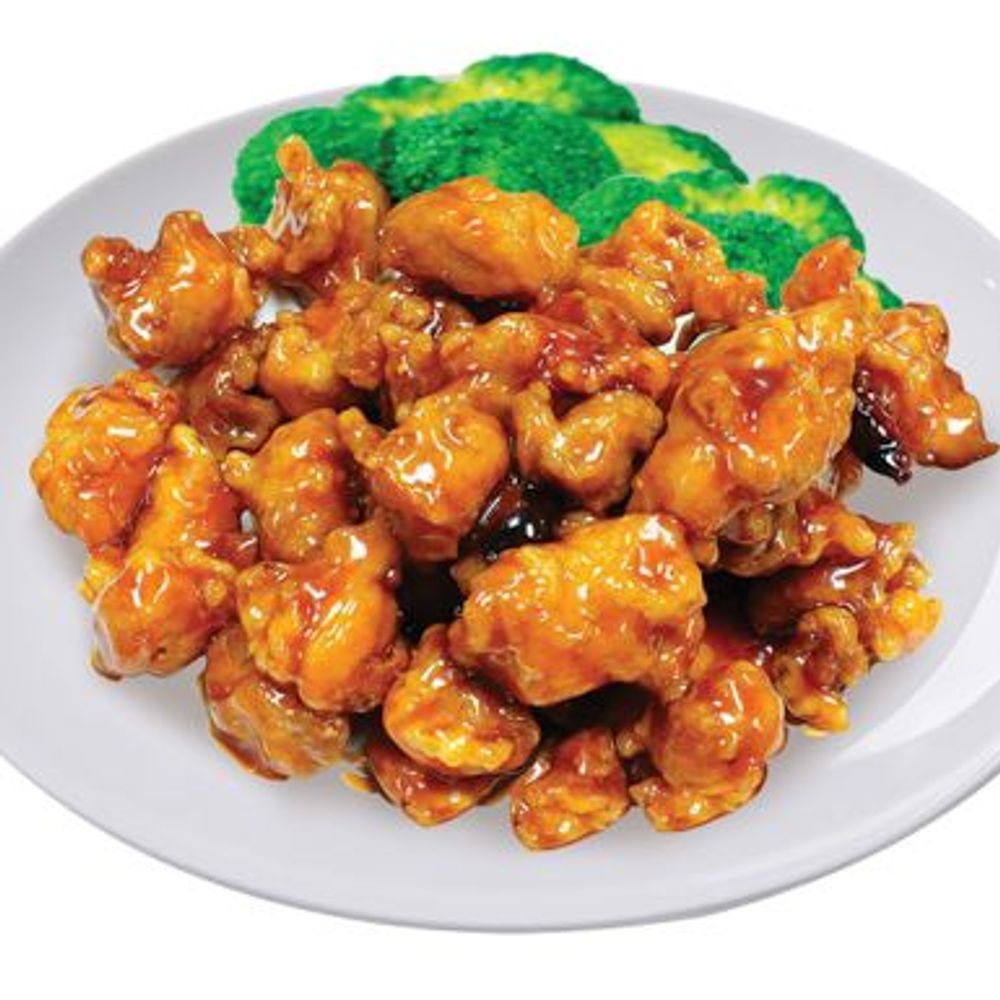 Glazed orange chicken pieces served with fresh broccoli florets at Golden Dragon Restaurant, a Chinese Restaurant in East Troy