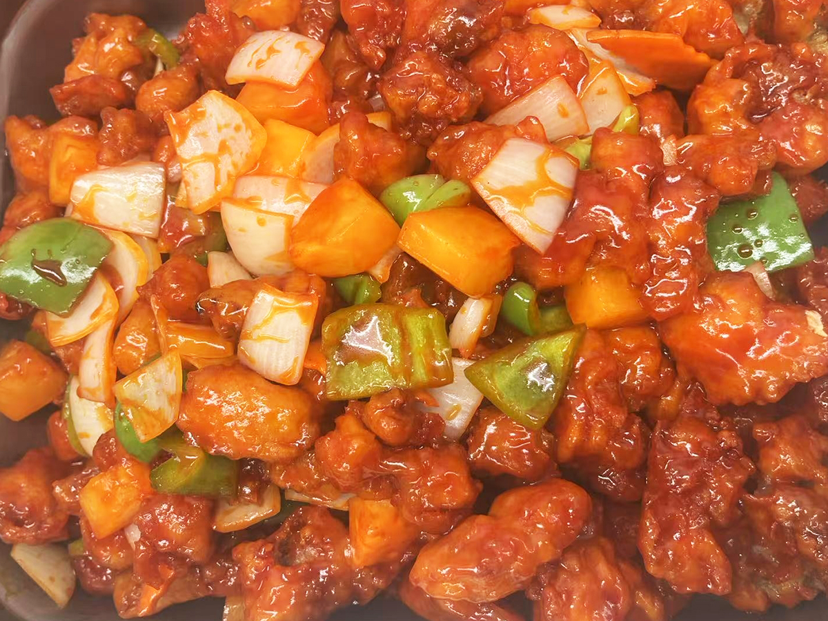 Golden-Dragon-Asian-Fusion-Restaurant-Sweet-and-Sour-Pork-with-Pineapple-Newman Sweet and Sour Pork with Pineapple, featuring pieces of pork, pineapple chunks, peppers, and onions in a glossy sauce at Golden Dragon,a Asian Fusion Restaurant in Newman