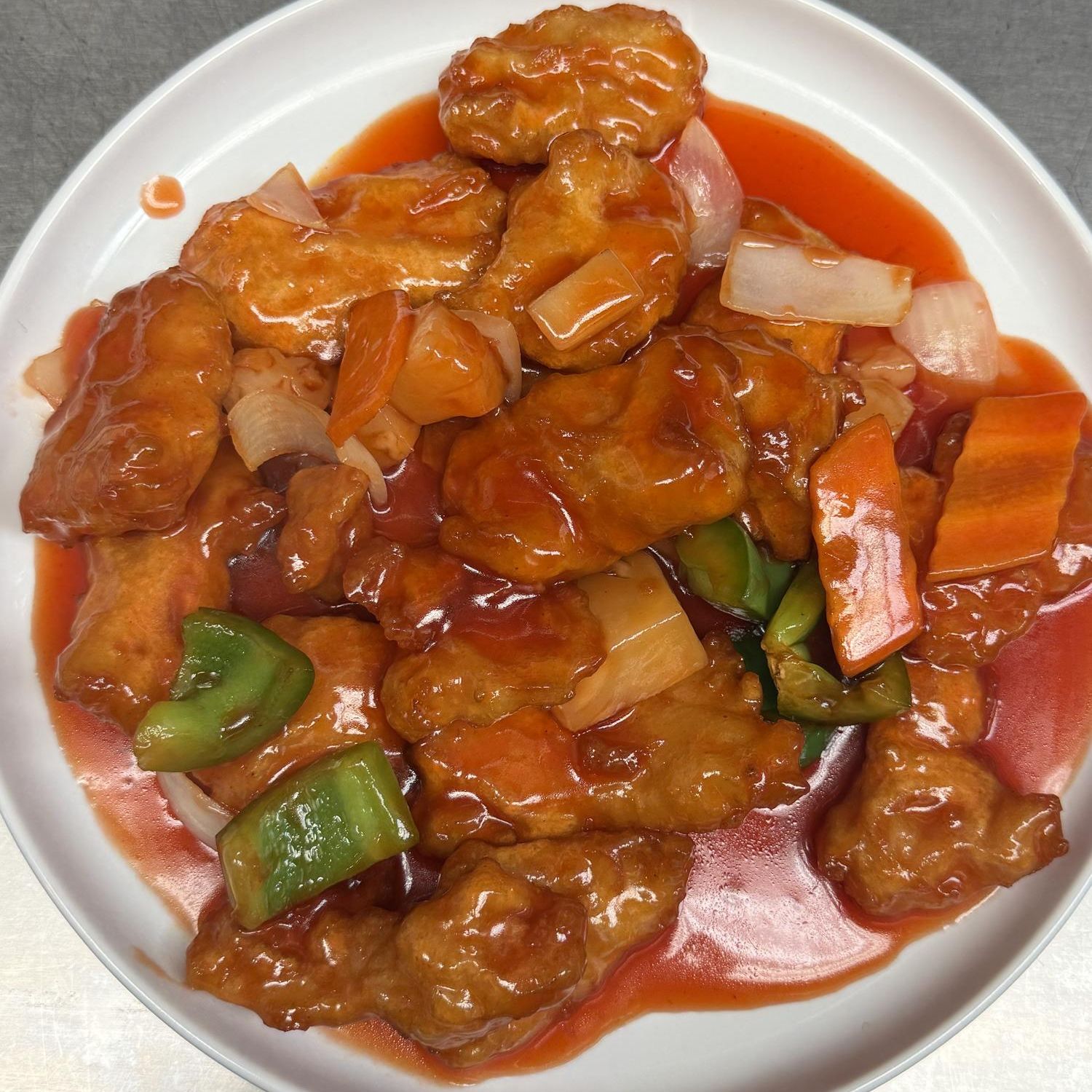 Sweet and sour chicken with bell pepper and onion at Golden Garden, a Chinese Restaurant in Sacramento
