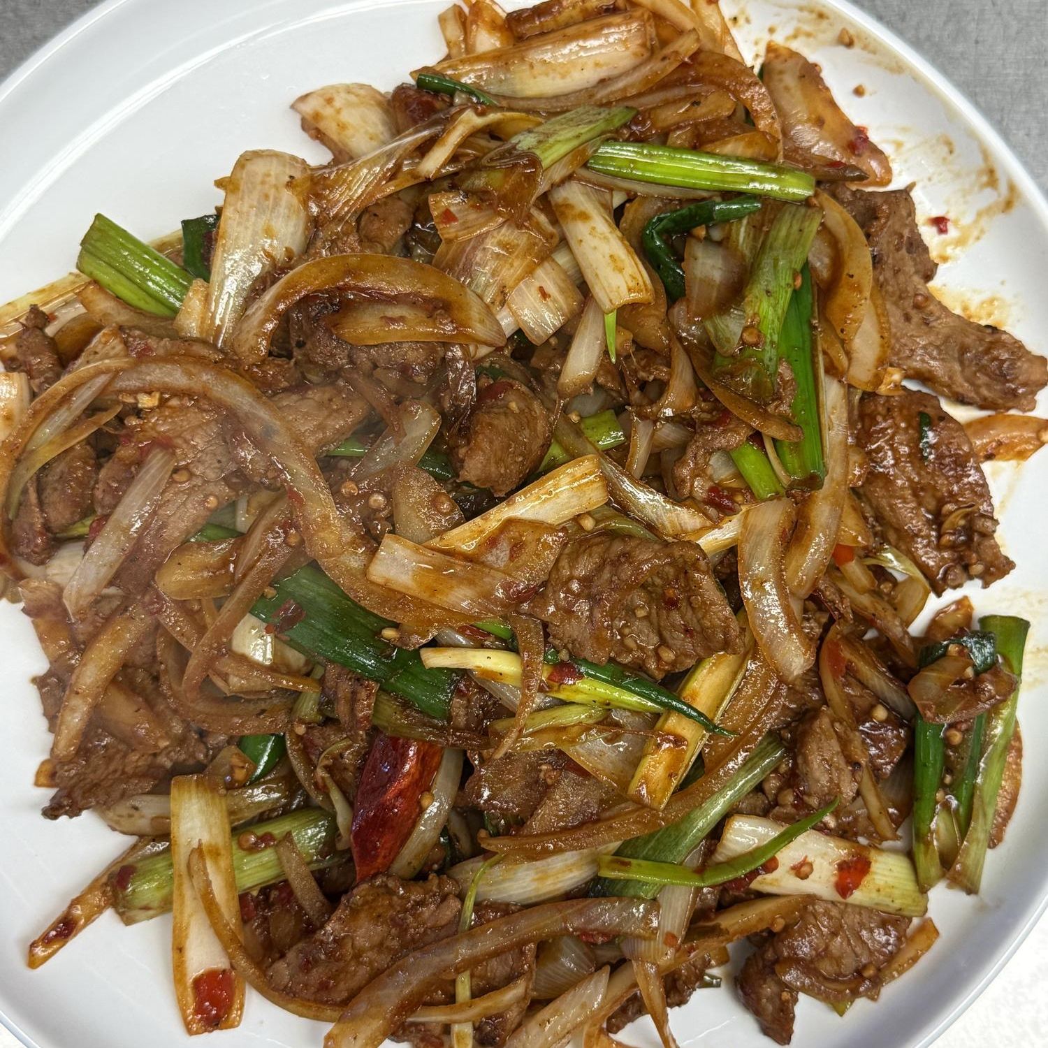 Szechuan beef with green onion and onion at Golden Garden, a Chinese Restaurant in Sacramento