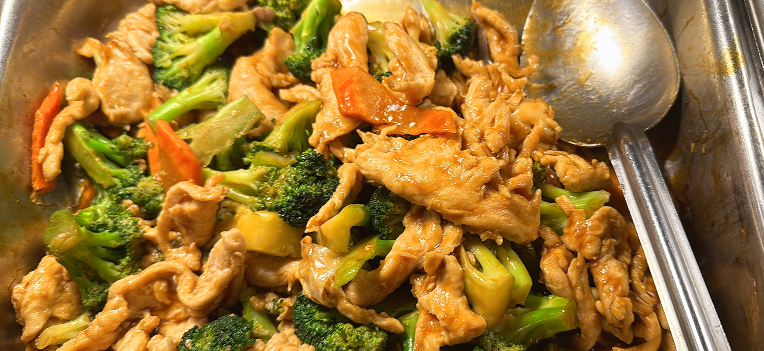 Chicken stir - fried with broccoli in a serving pan at Golden Wok，a Chinese Restaurant in Weaverville