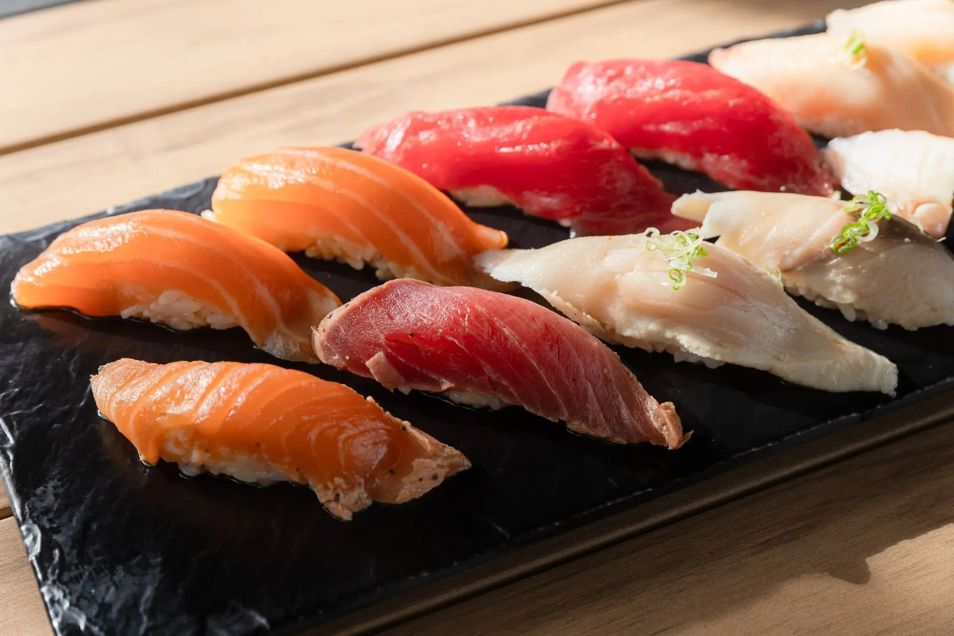Platter of various nigiri sushi with fresh fish at Niku Sushi, a Japanese restaurant in Anaheim