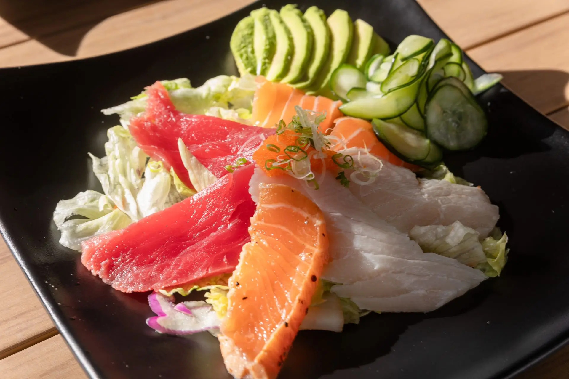 Salad with fresh sashimi, avocado, cucumber and lettuce at Niku Sushi, a Japanese restaurant in Anaheim