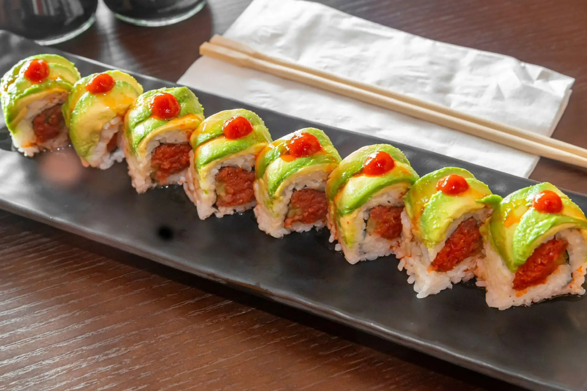 Sushi roll with spicy tuna, avocado and rice at Niku Sushi, a Japanese restaurant in Anaheim