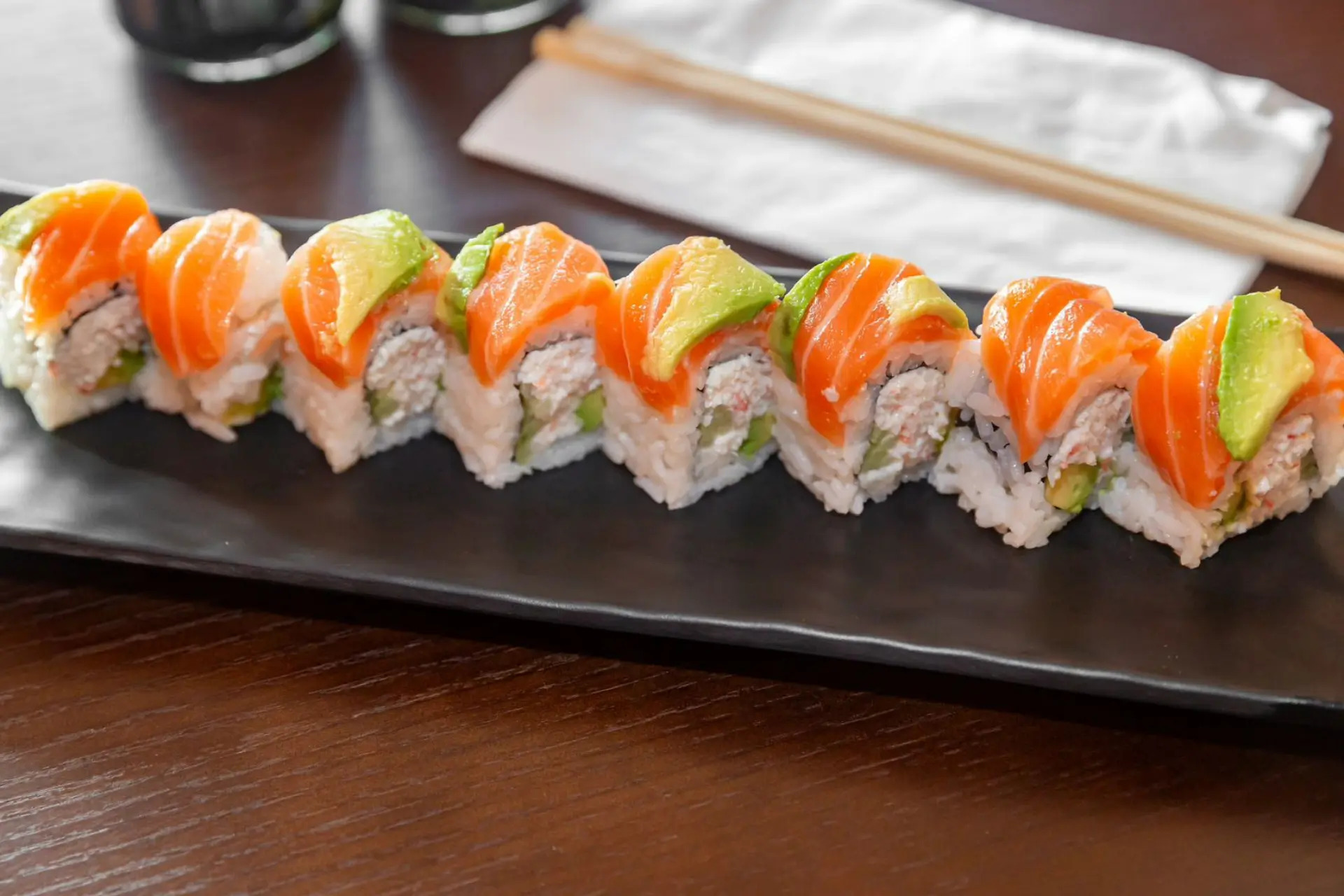 Sushi roll with salmon, avocado and crab filling at Niku Sushi, a Japanese restaurant in Anaheim