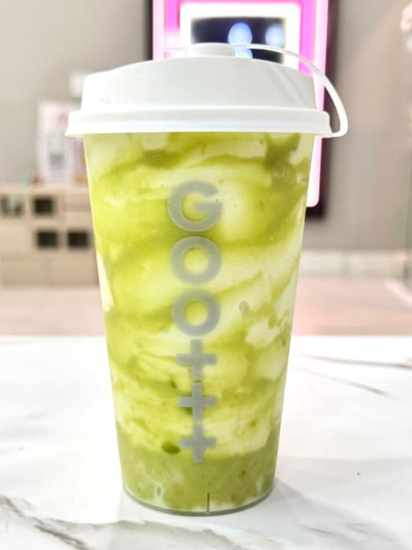 Swirled matcha cream slush in branded plastic cup at Goomo Tea, a Bubble Tea Store in CA