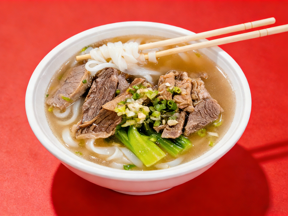 Bowl of beef noodle soup with chopsticks at Gourmet House，a Chinese Restaurant in Algonquin