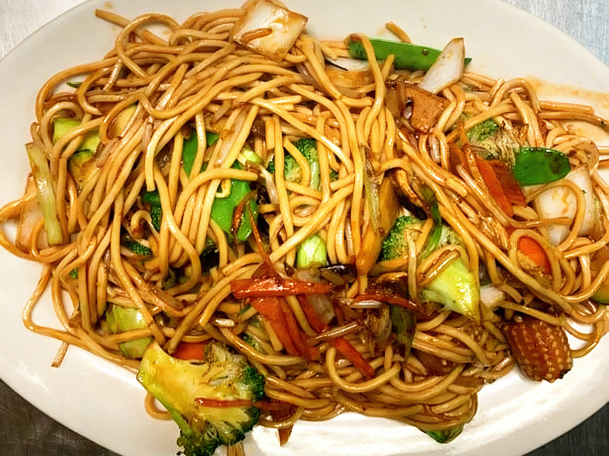 Stir-fried noodles, mixed vegetables, served in a light sauce at Gourmet House，a Chinese Restaurant in Algonquin