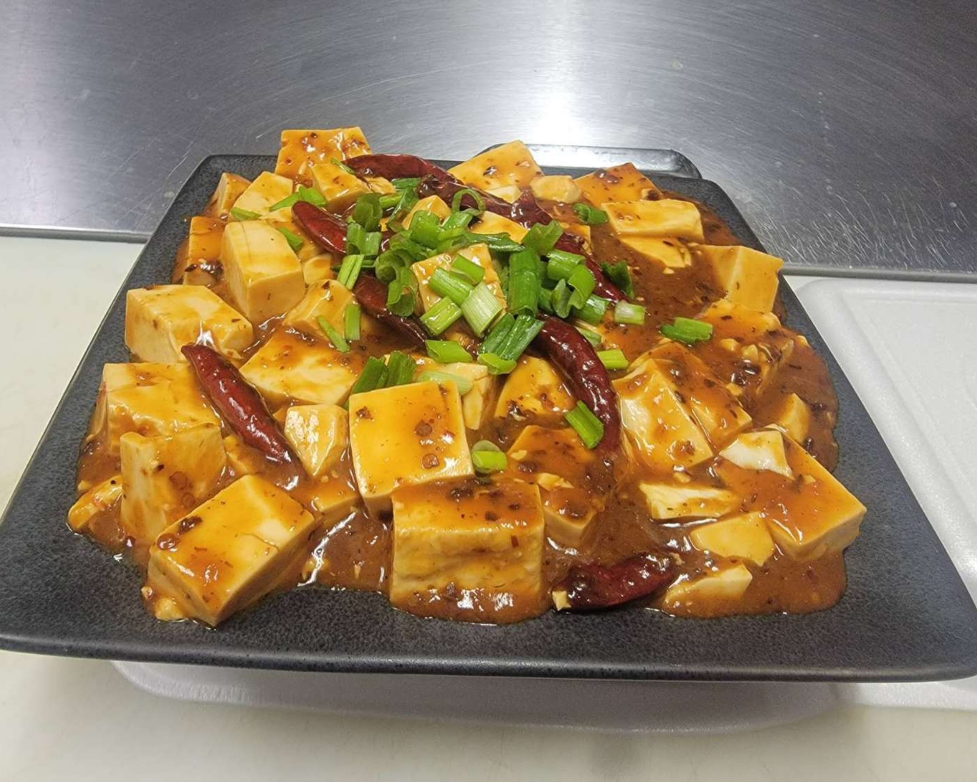 Gourmet-Wok-Chinese-Food-Chinese-Restaurant-Ma-Po-Tofu-Las-Vegas Spicy Ma Po tofu with scallions at Gourmet Wok Chinese Food, a Chinese restaurant in Las Vegas.