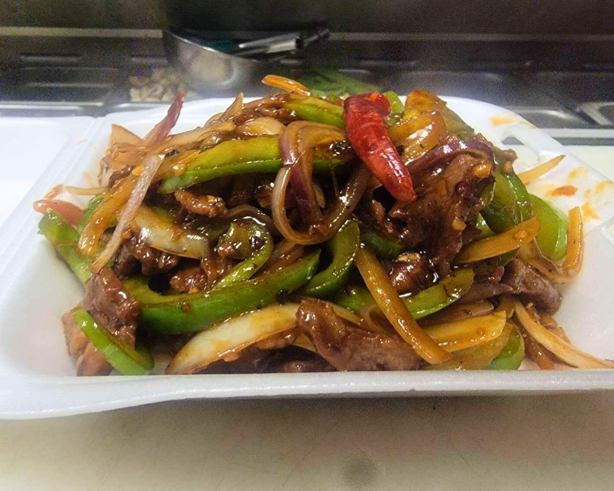 Gourmet-Wok-Chinese-Food-Chinese-Restaurant-Pepper-Steak-Las-Vegas Pepper steak with green peppers and onions at Gourmet Wok Chinese Food, a Chinese restaurant in Las Vegas.