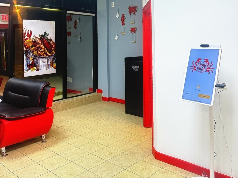 Lobby with seating and order kiosk at Grab Crab, a Seafood Restaurant in Pontiac