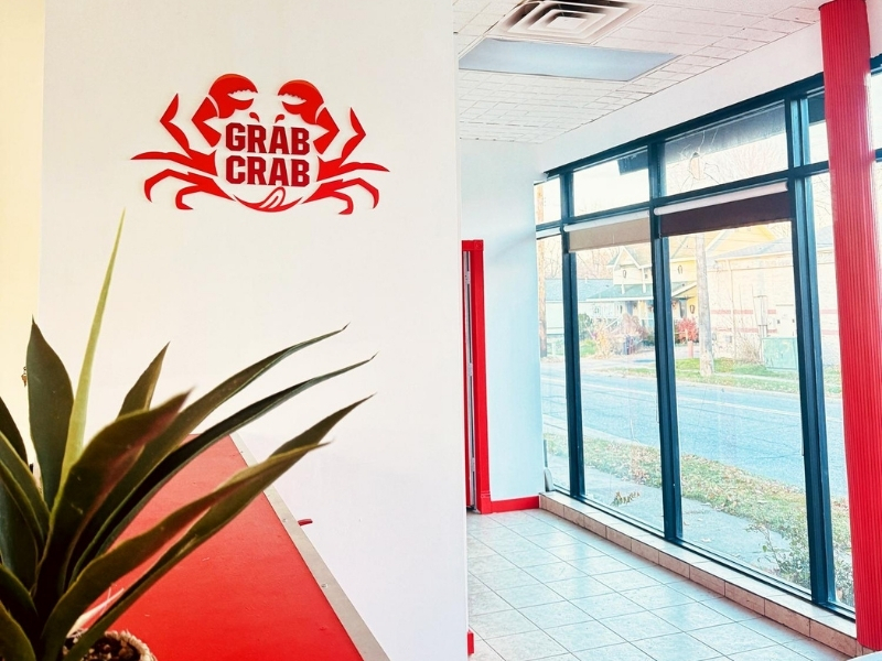 Wall sign and window view at Grab Crab, a Seafood Restaurant in Pontiac