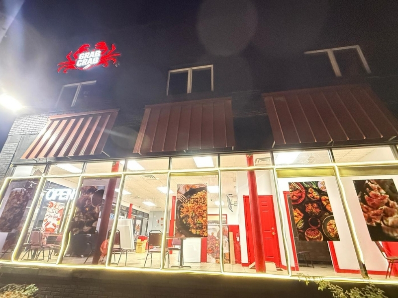 Illuminated Grab Crab exterior at night at Grab Crab, a Seafood Restaurant in Pontiac