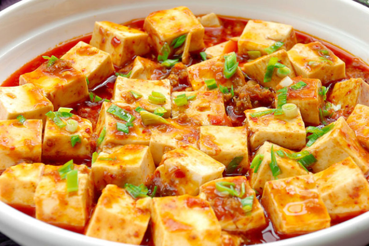 Spicy mapo tofu in red chili sauce at Grandma's Dim Sum, a Chinese Restaurant in Flushing