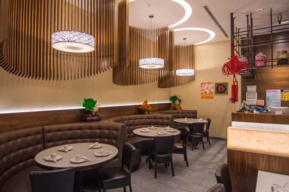 Modern dining interior with booth seating at Grandma's Dim Sum, a Chinese Restaurant in Flushing