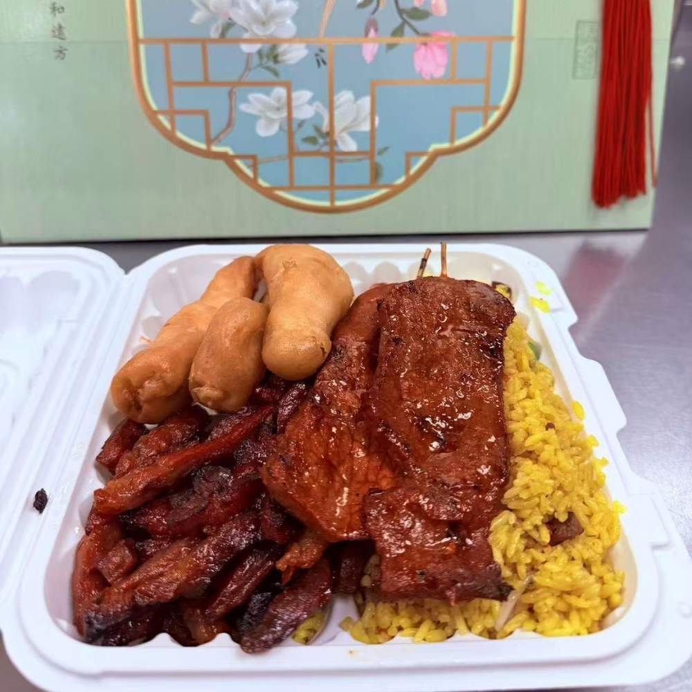 Grilled barbecue pork with sausages and yellow rice at Great China, an Chinese Restaurant in Naugatuck