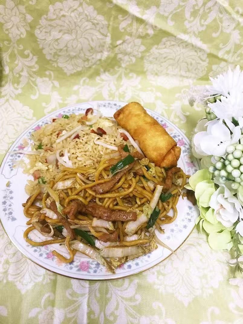 Combination plate with fried rice, lo mein and spring roll at Green Heaven - Chinese Restaurant in Holmes