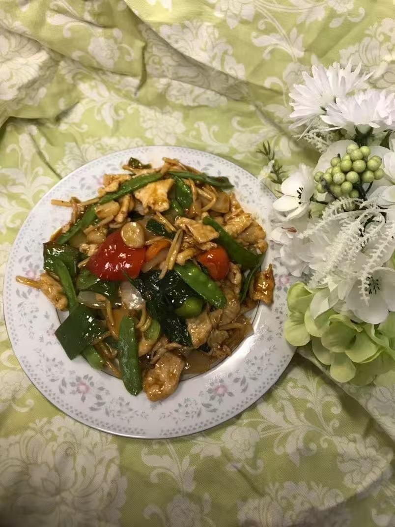 Chicken and vegetable stir-fry with snow peas and peppers at Green Heaven - Chinese Restaurant in Holmes