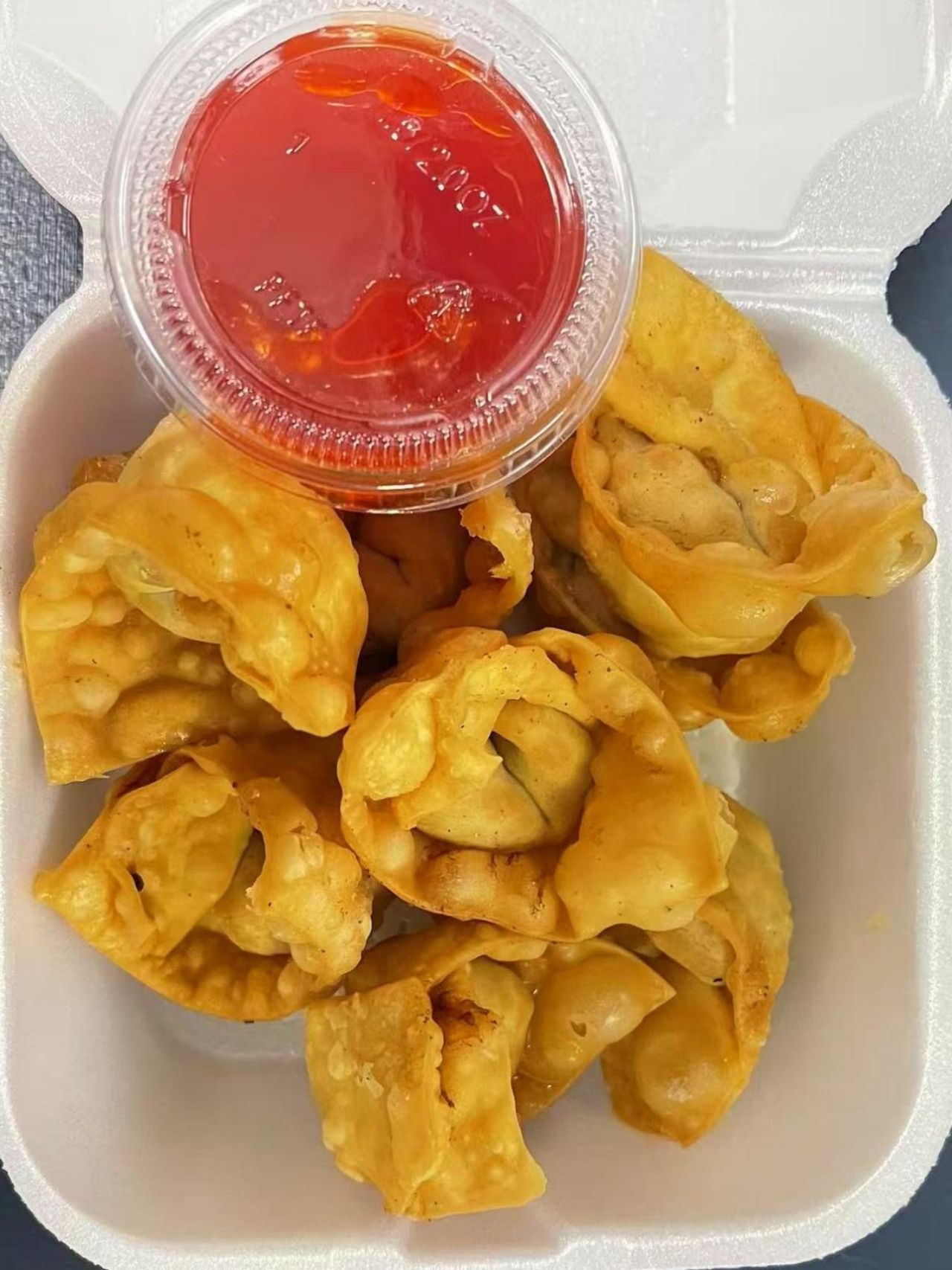 Crispy fried wontons with red dipping sauce at Green Jade,a Chinese Restaurant in Depew.