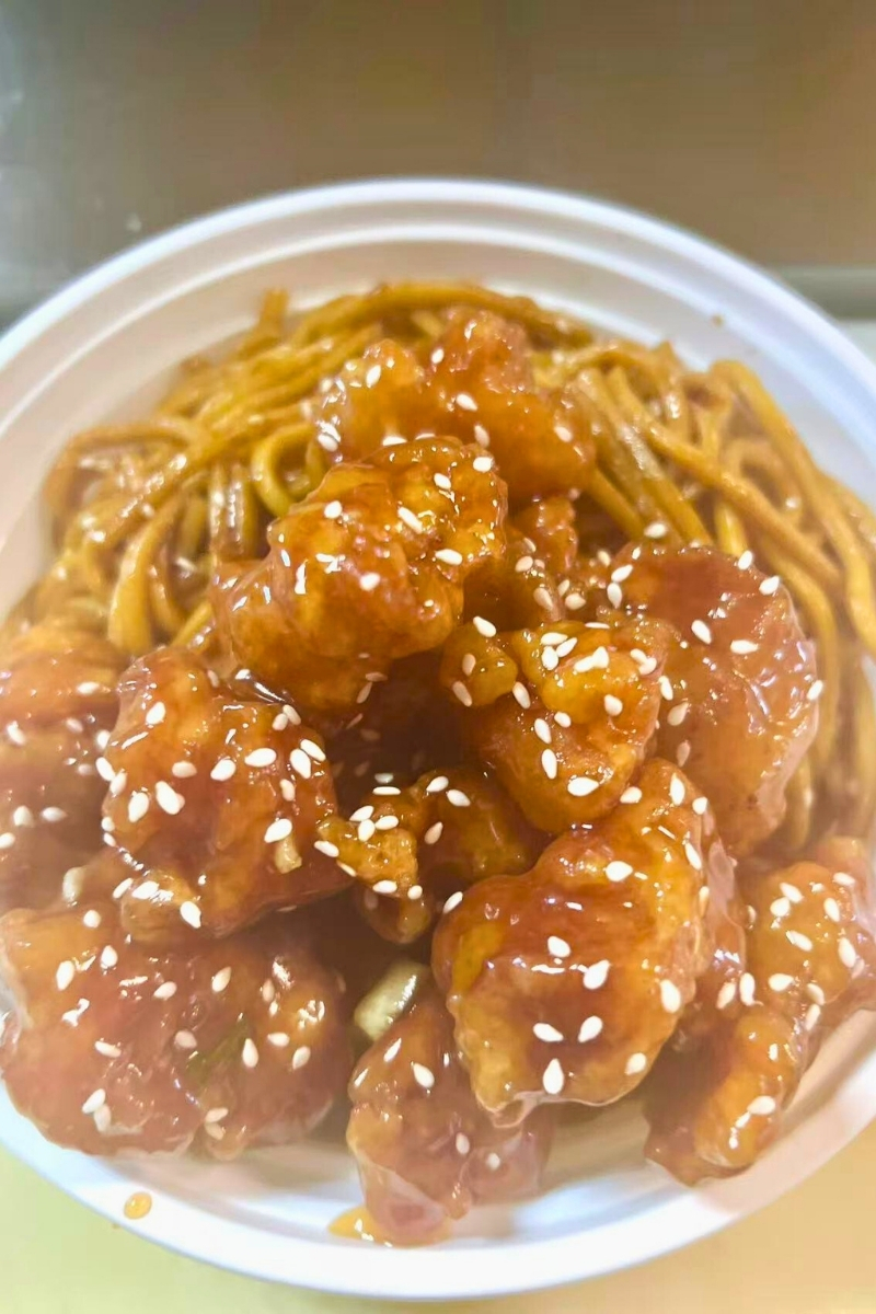 Sesame - seeded chicken with lo mein at Green Jade,a Chinese Restaurant in Depew