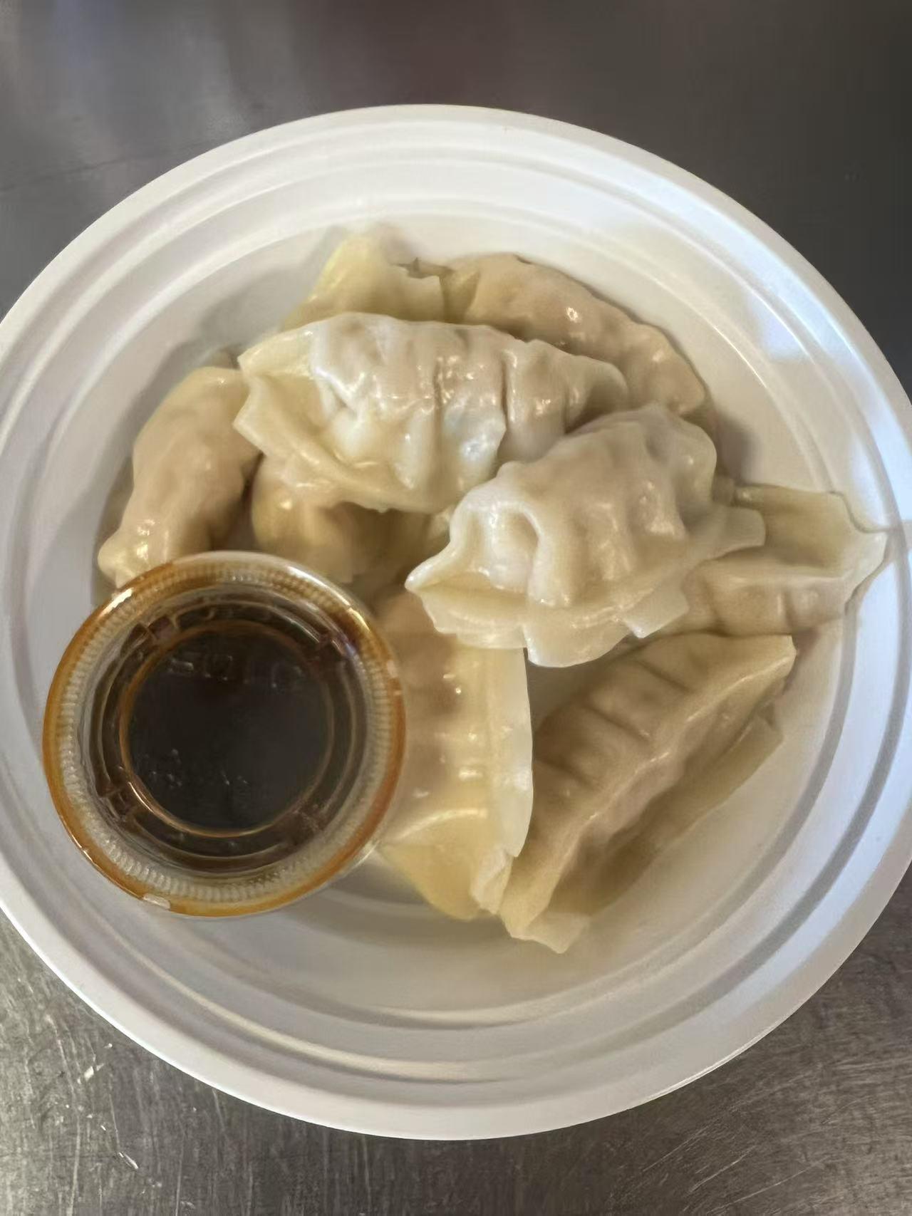 Steamed dumplings with dipping sauce at Green Jade,a Chinese Restaurant in Depew.