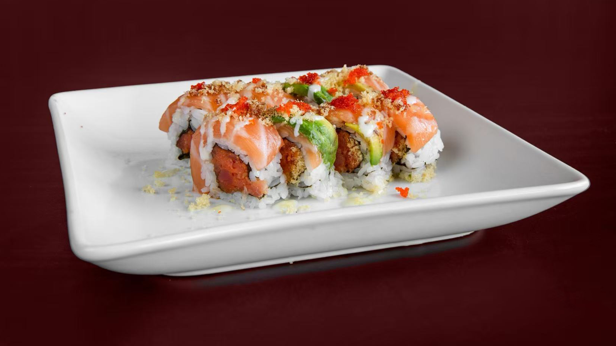 Salmon sushi with toppings at Green Tea Sushi Bar，a Japanese Restaurant in Covington