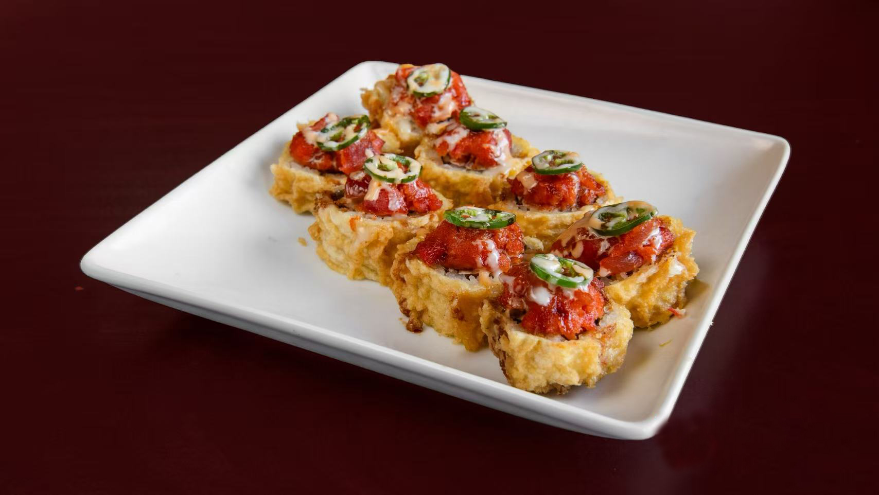 Sushi bites with tomato topping at Green Tea Sushi Bar，a Japanese Restaurant in Covington