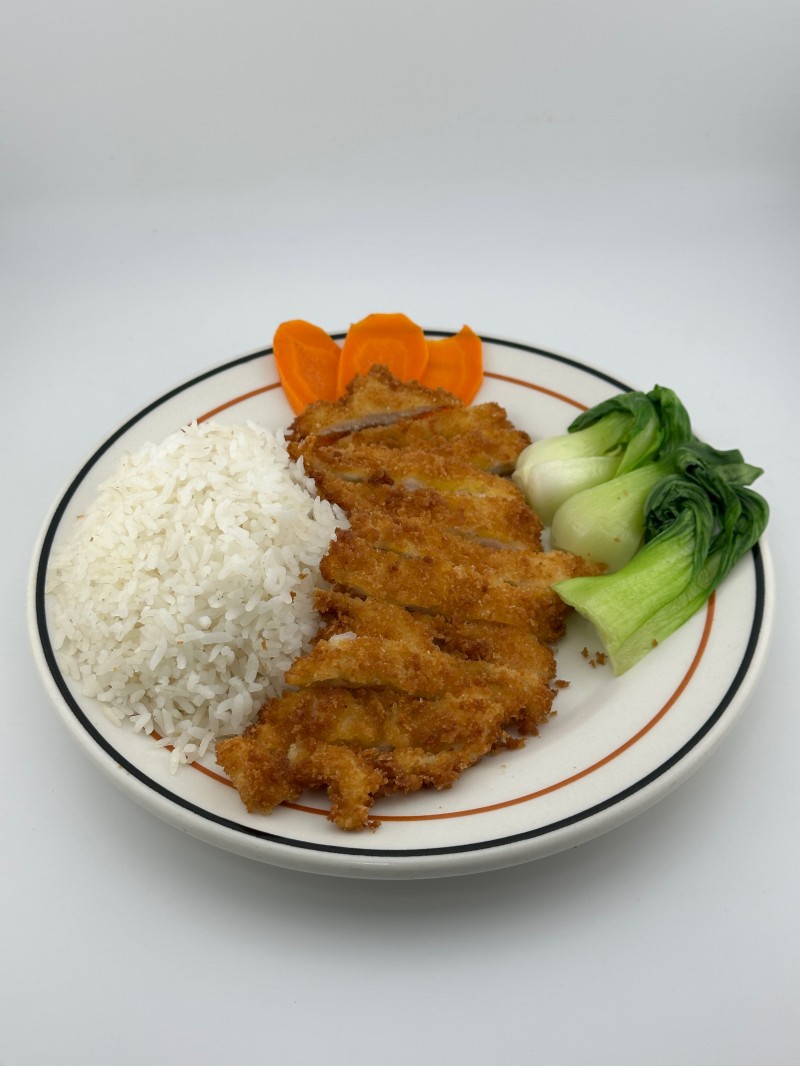 Rice with crispy chicken chop and veggies at Mei Mei Cafe, a Chinese Restaurant in Seattle