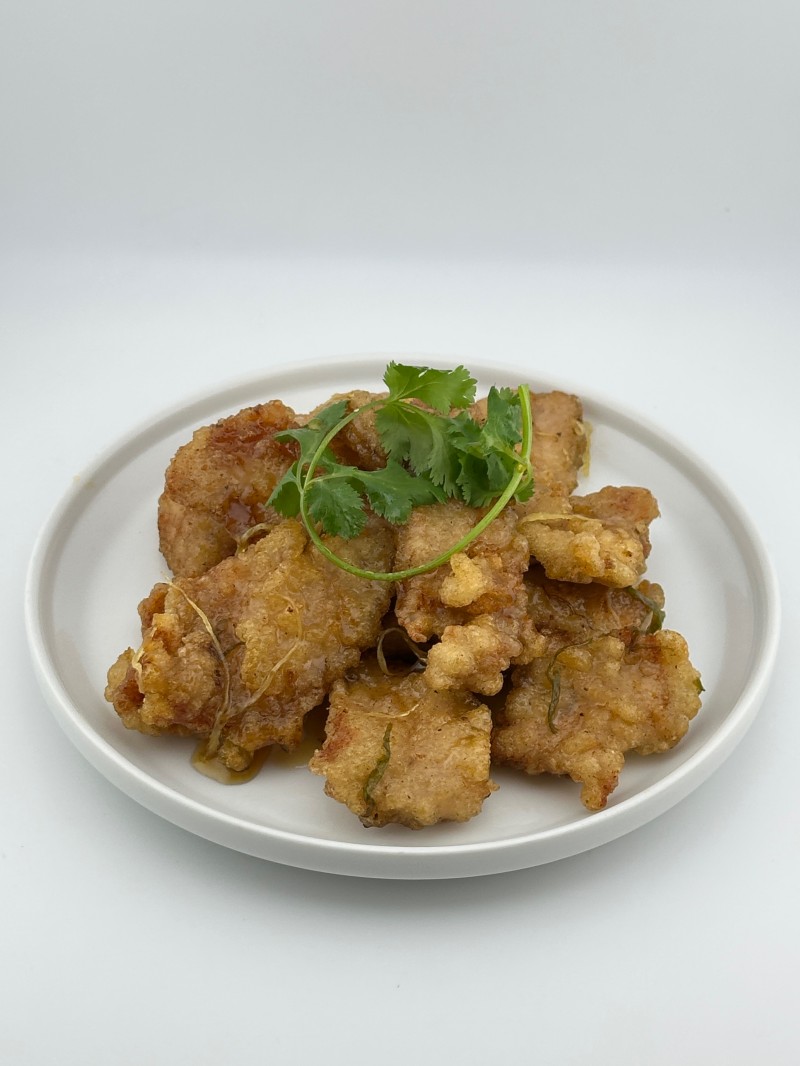 Crispy fried pork with savory sauce at Mei Mei Cafe, a Chinese Restaurant in Seattle