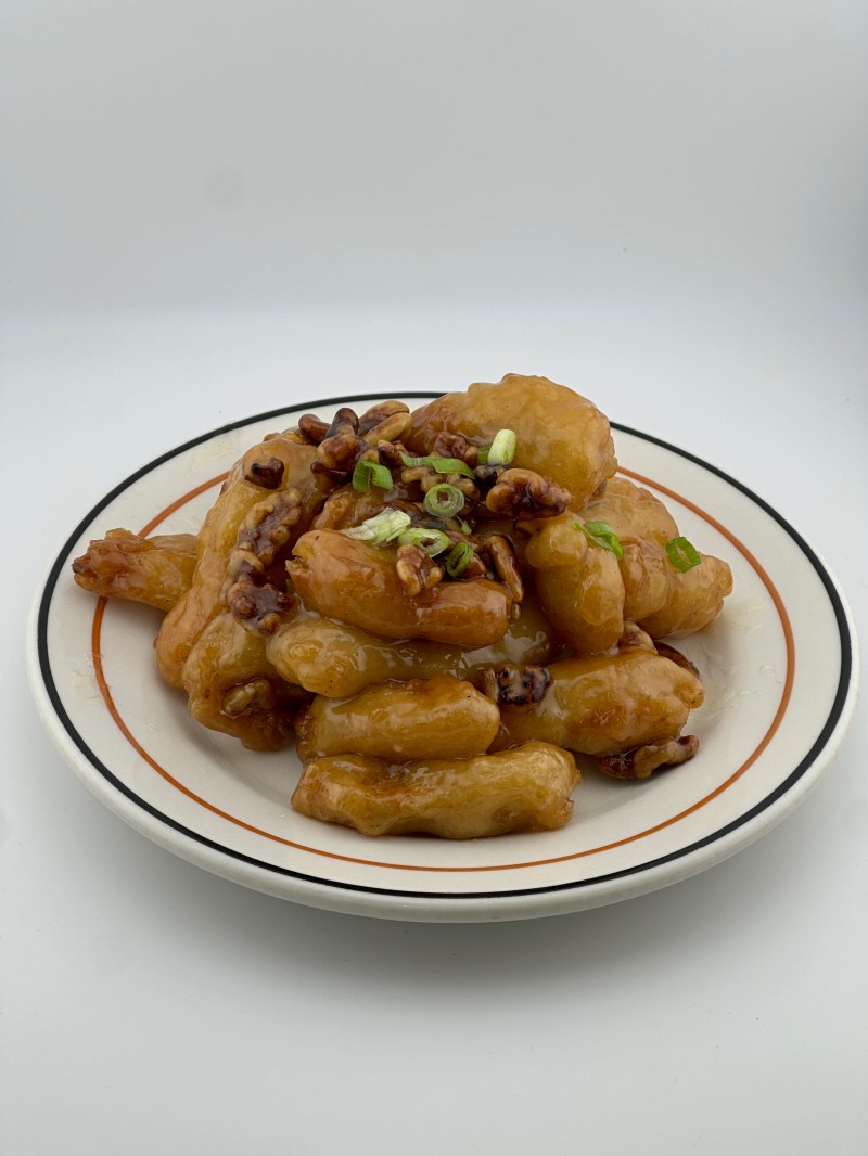 Crispy shrimp coated in sweet sauce, topped with walnuts and scallions at Mei Mei Cafe, a Chinese Restaurant in Seattle