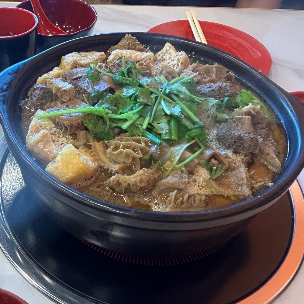 A hot pot with beef tripe and other ingredients at GWONGFU BEEF MIX INC, a Chinese Restaurant in Brooklyn